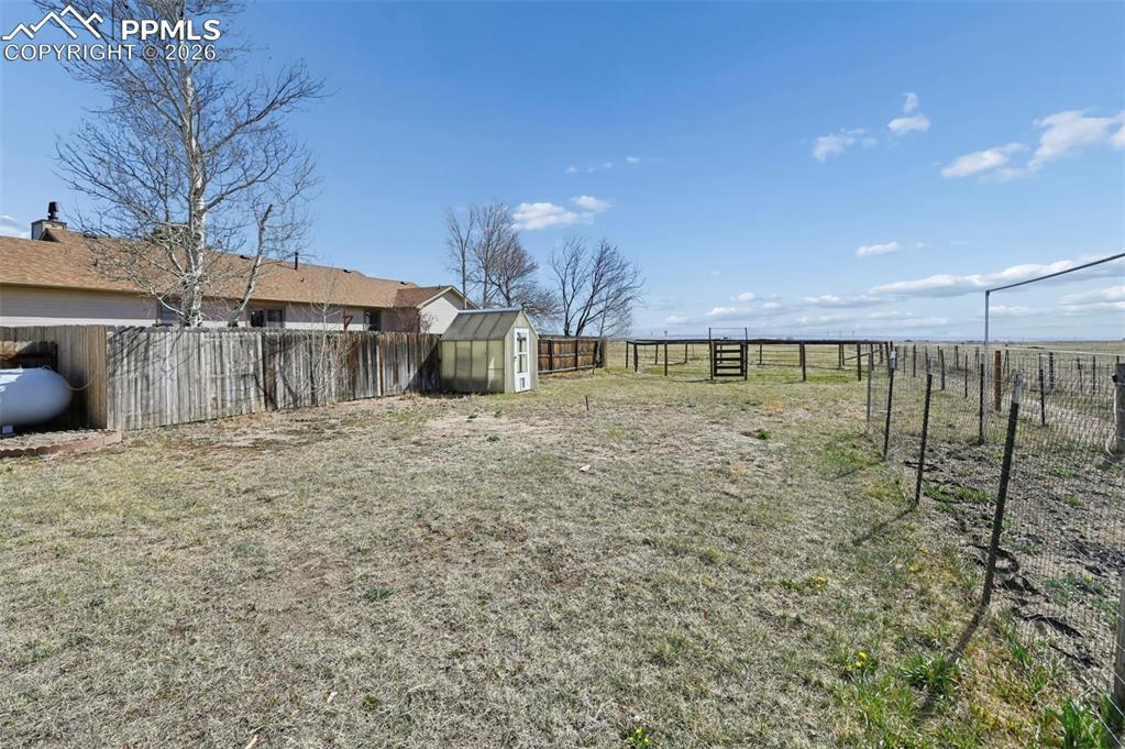 Image 33 of 49: Fenced in BackYard