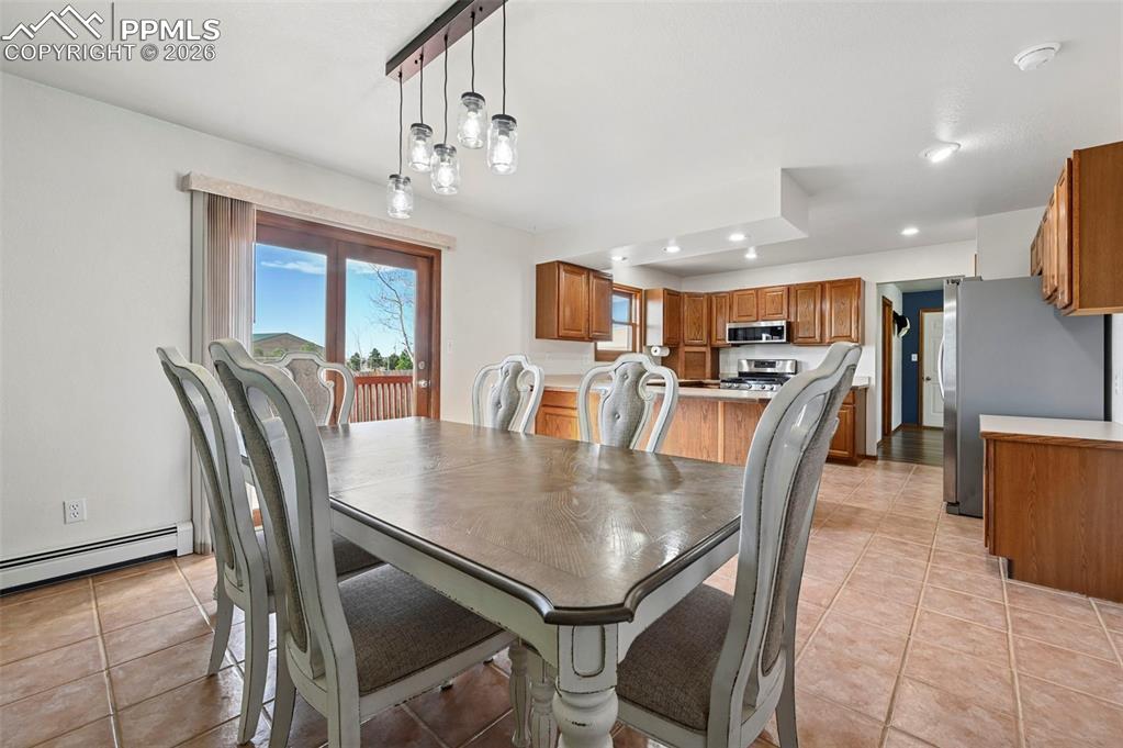 Image 6 of 49: Build-in Solid Wood Shelving and Wood Burning Fireplace