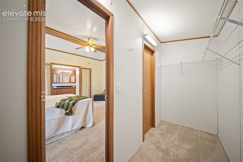Image 16 of 40: Walk in closet