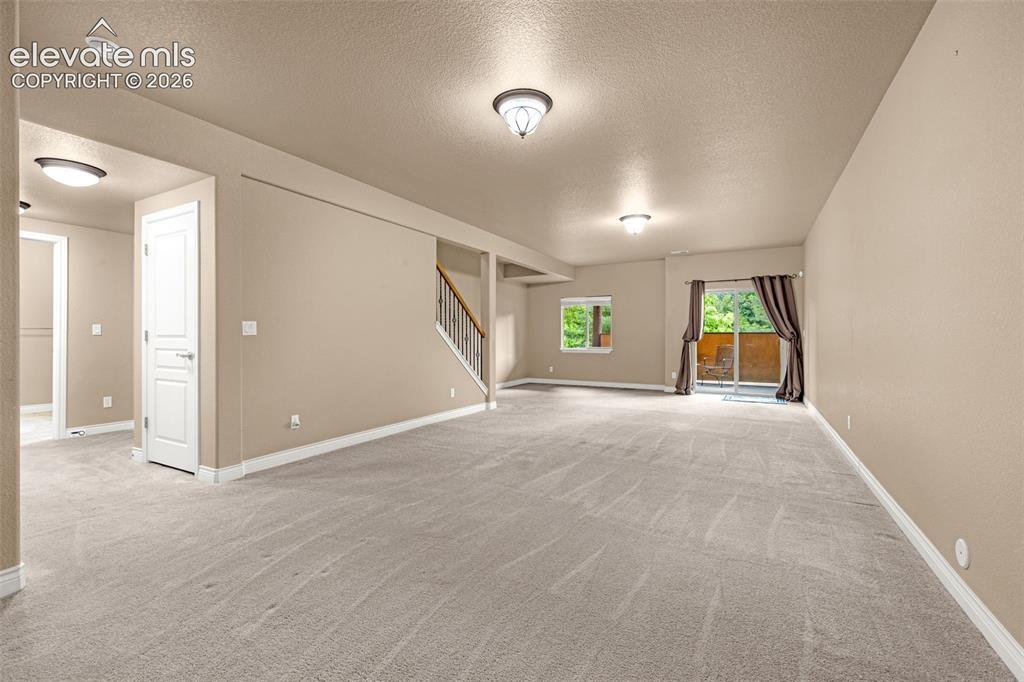 Image 26 of 48: Walk-out family room in basement