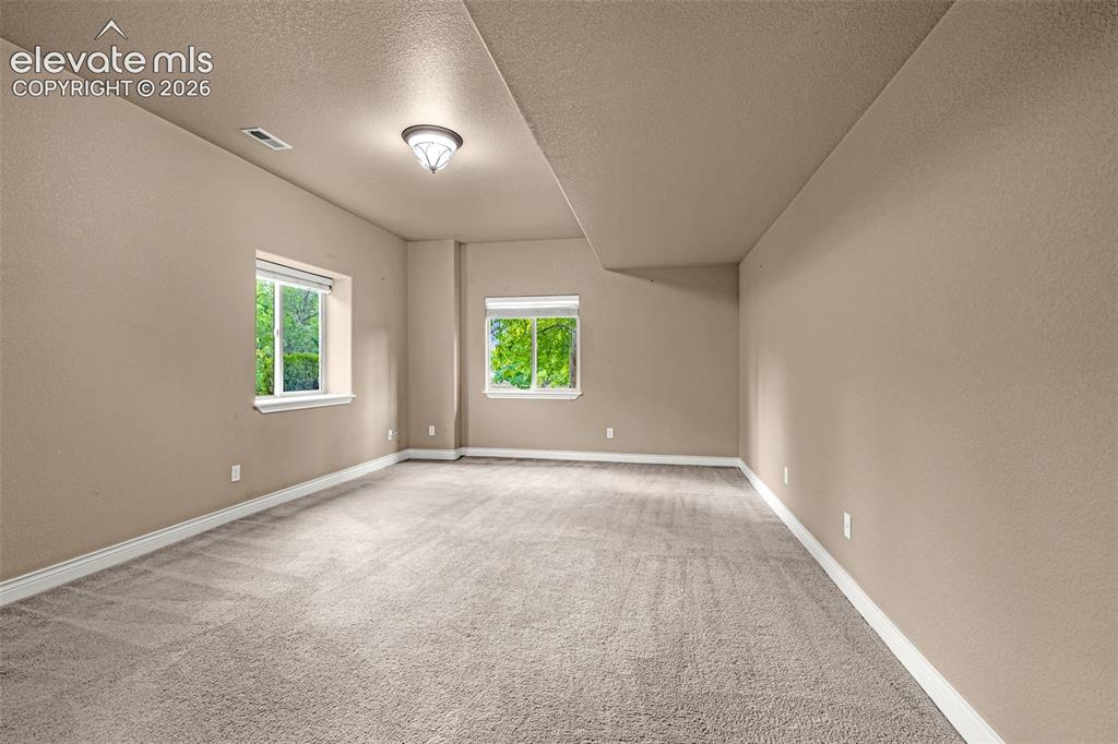 Image 27 of 48: Spacious bedroom in basement