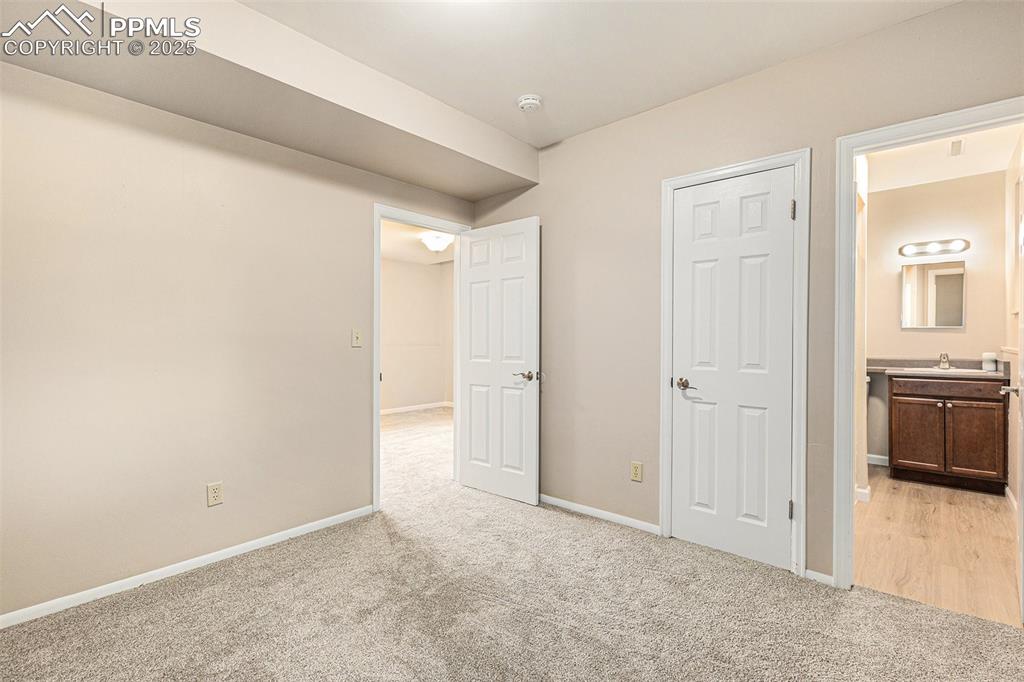 Image 15 of 29: Unfurnished bedroom featuring brand new light color carpet and ensuite bath