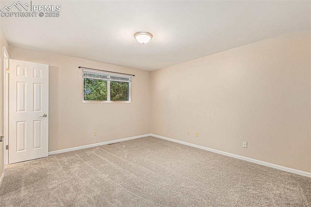 Image 19 of 29: Bedroom with new carpet