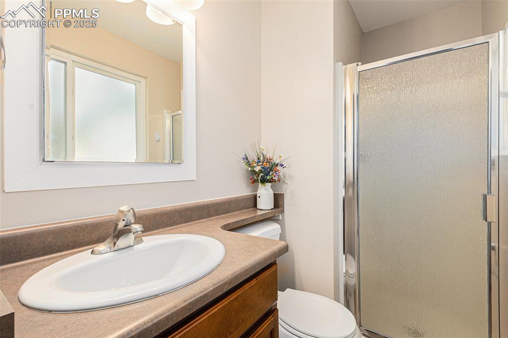 Image 20 of 29: Full bathroom featuring vanity and shower
