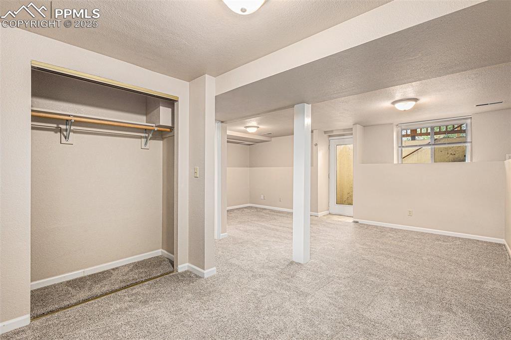 Image 27 of 29: Basement bedroom with closet, bathroom and private entrance