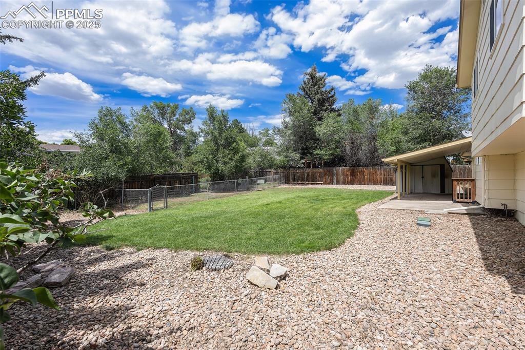 Image 28 of 29: View of fenced backyard