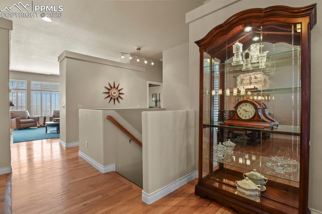 Image 26 of 46: Showing the staircase with a wooden handrail and attractive and easy clean 