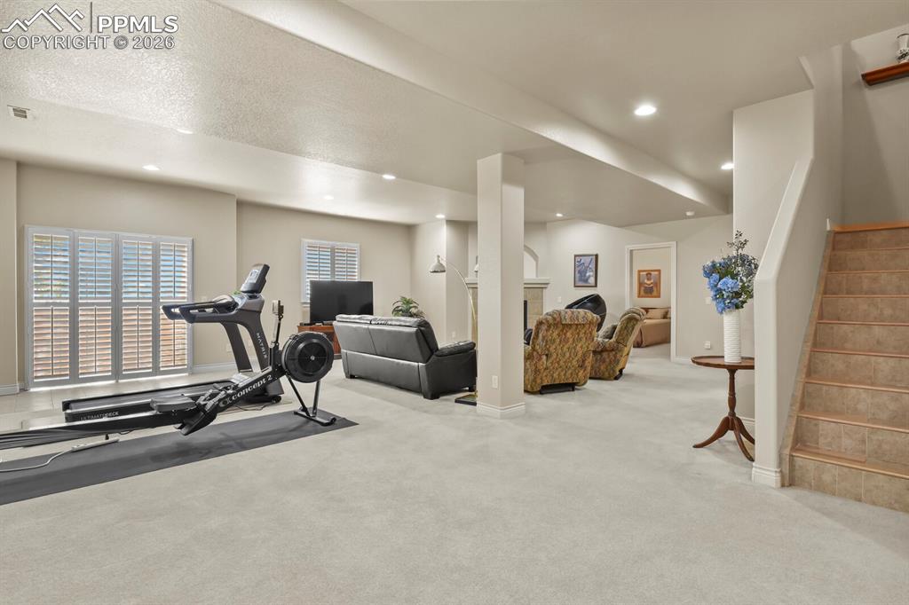 Image 27 of 46: Spacious Family Room area with walkout to a second covered patio area,  rec