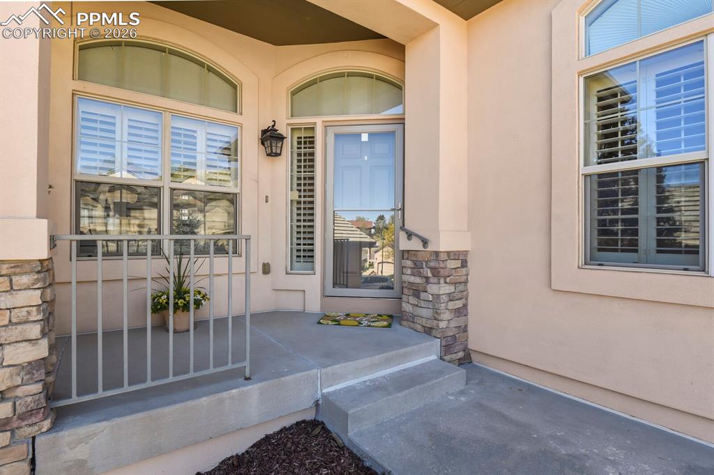 Image 3 of 46: Welcoming covered entry.