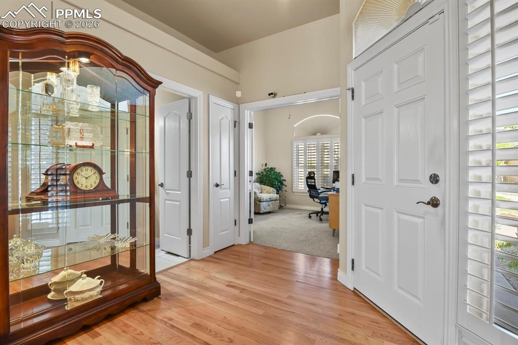 Image 4 of 46: The property features hardwood flooring and leading to the office(2nd bedro