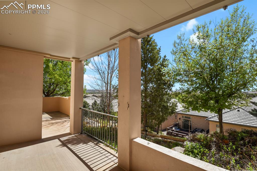 Image 40 of 46: The property features a second covered patio with a concrete floor and meta