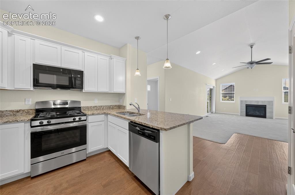 Image 11 of 43: Kitchen with stainless steel appliances