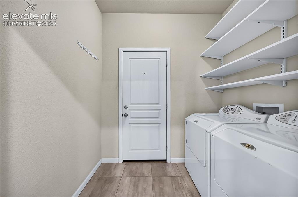 Image 13 of 43: Laundry with storage space.