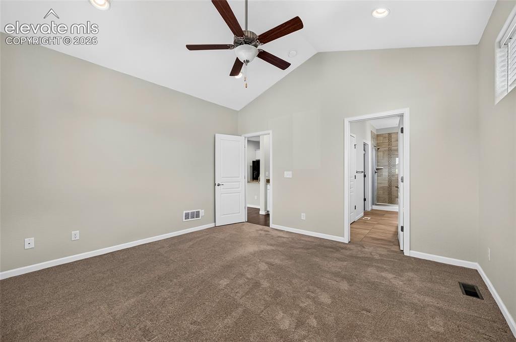 Image 22 of 43: Spaciuos primary bedroom offers a comfortable retreat with plenty of room f
