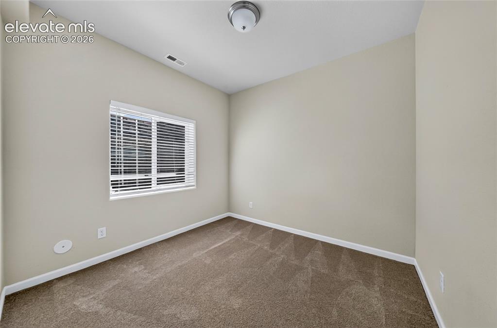 Image 25 of 43: Bedroom three. Bright and versitale secondary bedroom with ample sapce for