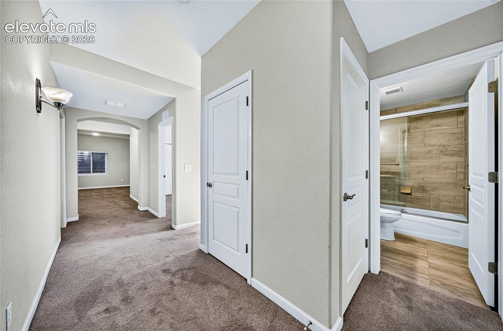 Image 29 of 43: Bright roomy hallway.