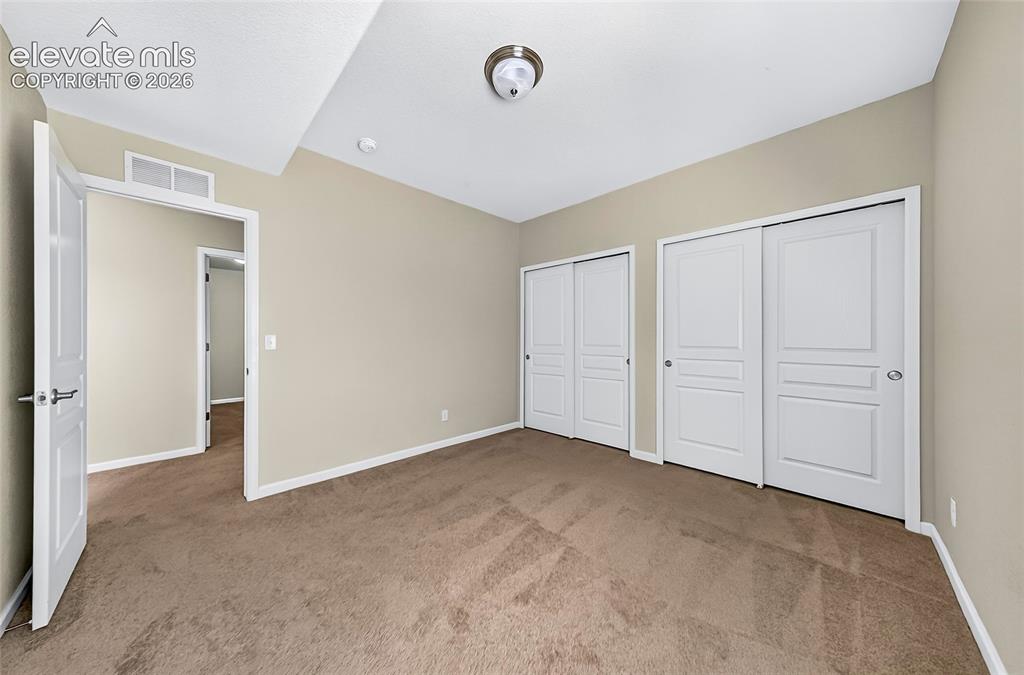 Image 32 of 43: Bedroom four. Bright and verstile bedroom offering comfotable lining space 