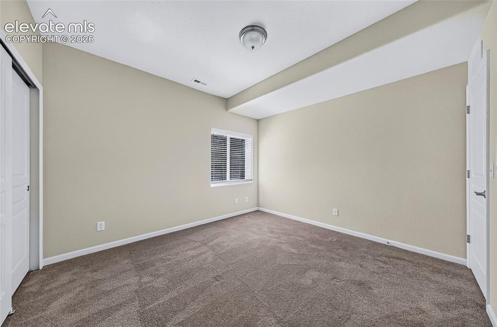 Image 33 of 43: Bedroom four. Invinting bedroom with generous closet space and a versatile 