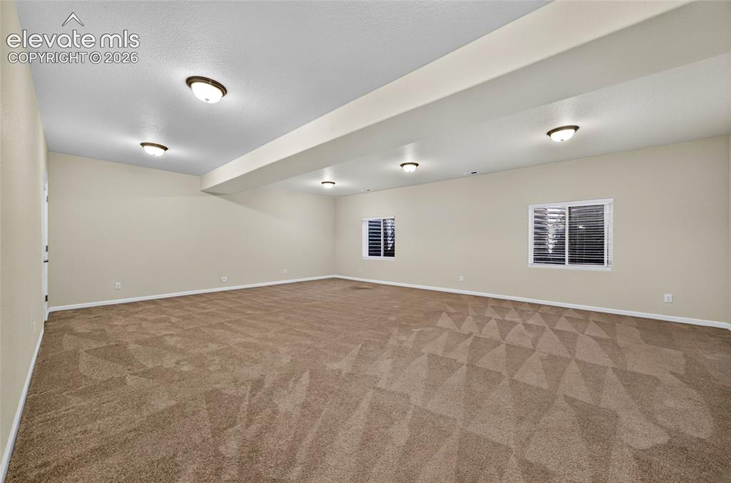 Image 36 of 43: Oversize great room offering an expansive flexoble living area- ideal for a