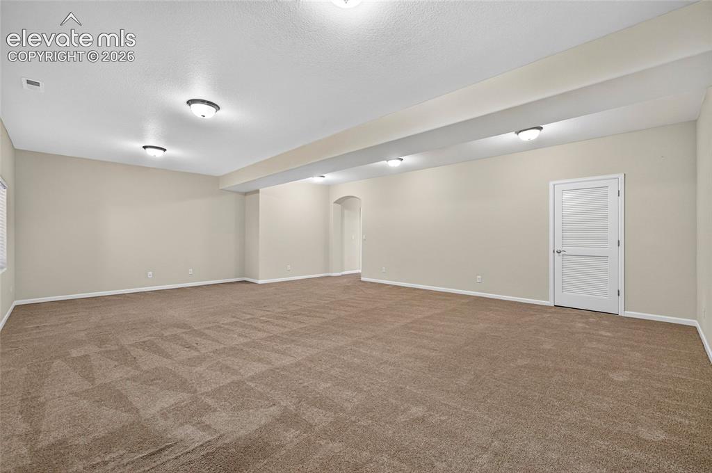 Image 37 of 43: Great room for entertainment or a home gym.