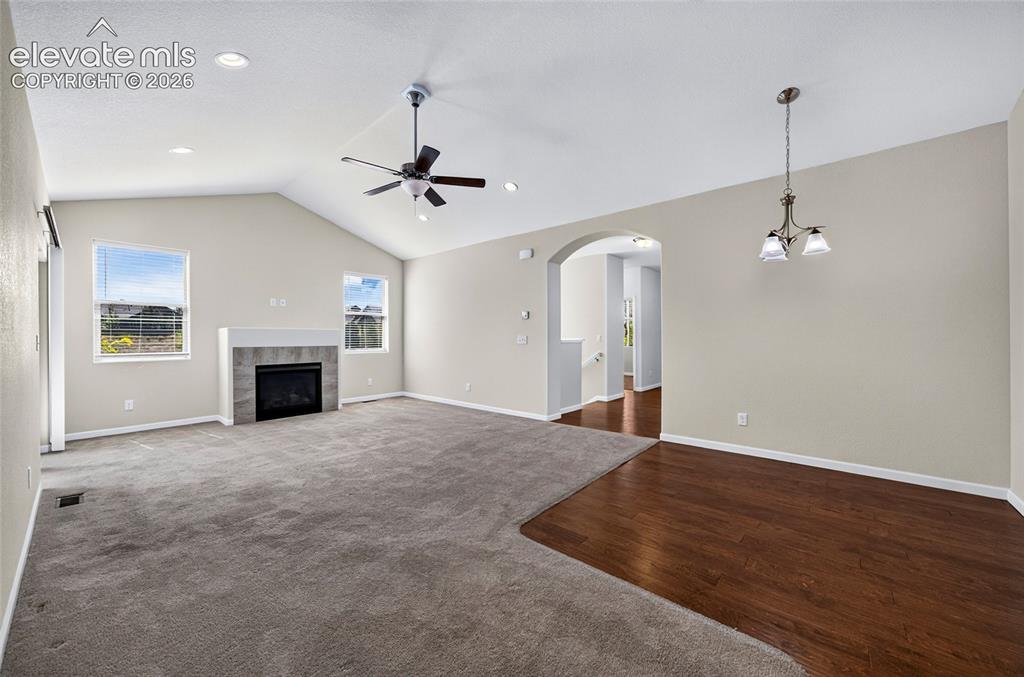 Image 7 of 43: Open concept living room offers a spacious, connect layout perfect for ente