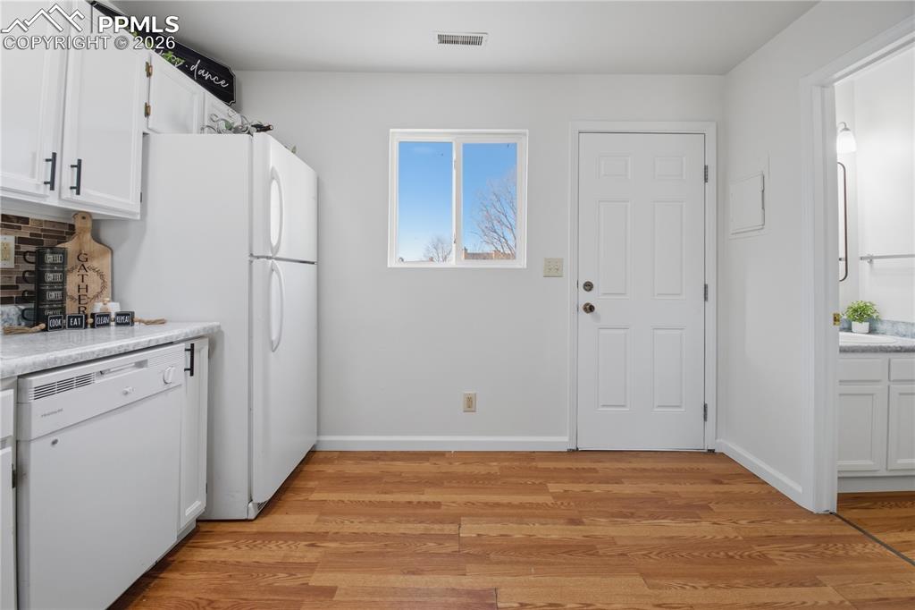 Image 12 of 29: Door to back patio