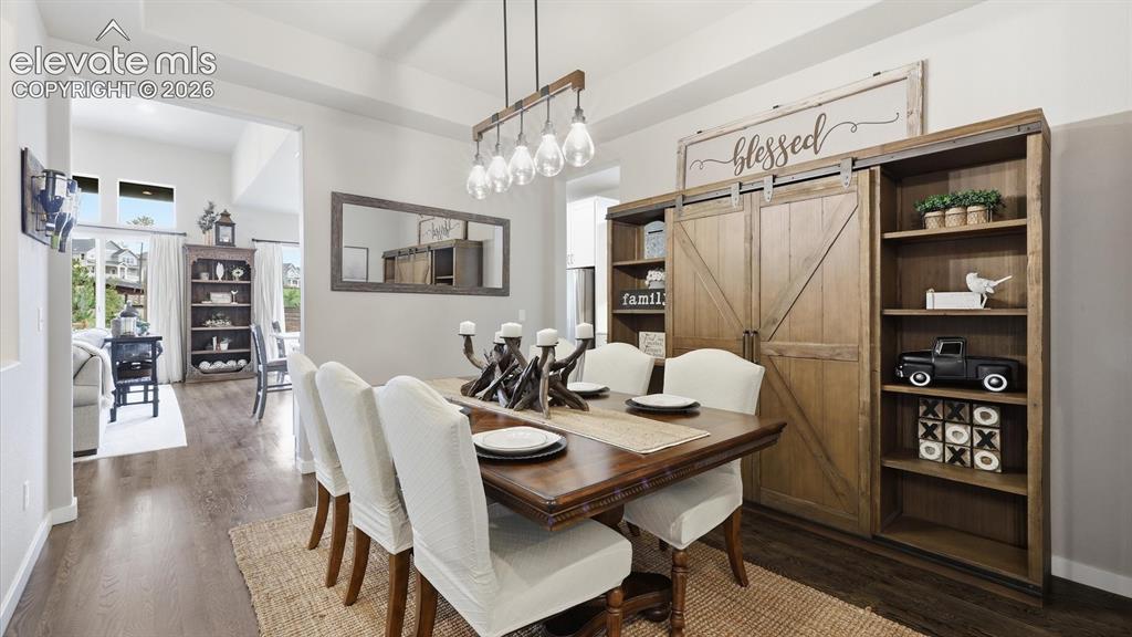 Image 18 of 50: EFFORTLESSLY CONNECTED — An elegant dining space perfectly positioned betwe