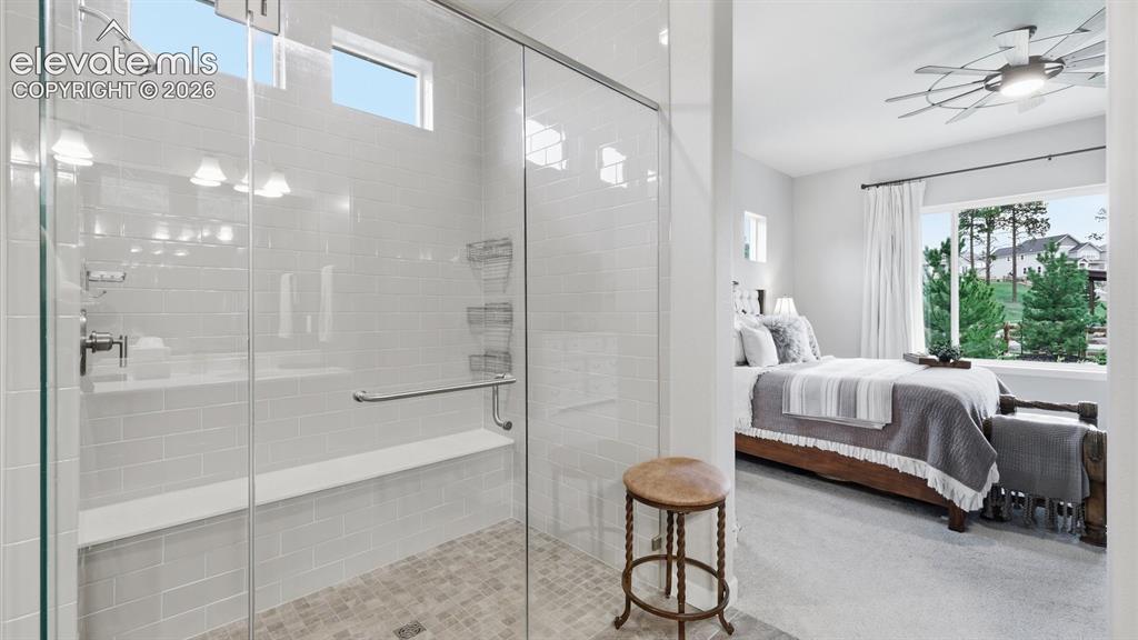 Image 23 of 50: SPA-INSPIRED ELEGANCE — A beautifully designed walk-in shower with a sleek