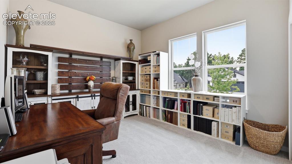 Image 26 of 50: GENEROUS MAIN-LEVEL LIVING — A spacious second main-level bedroom offers ex