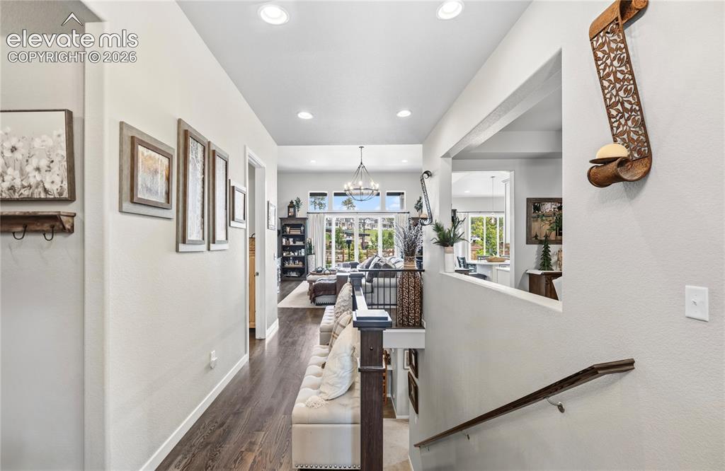 Image 31 of 50: Inviting entryway featuring wood-finish flooring, recessed lighting, and a
