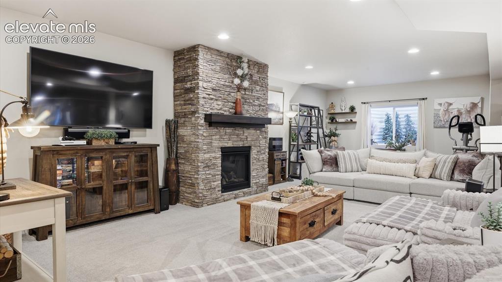 Image 31 of 50: FIRESIDE LUXURY, ON EVERY LEVEL — This expansive family room features a stu