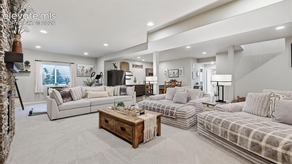 Image 32 of 50: ROOM TO LIVE & ENTERTAIN — This impressive lower-level family room provides