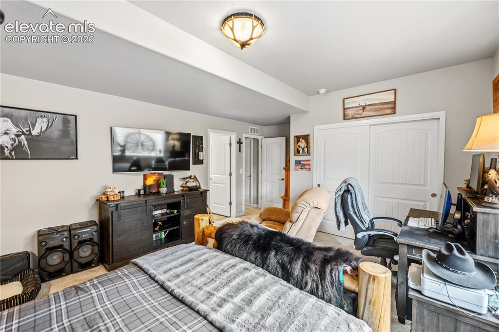 Image 43 of 50: Recessed lighting illuminates this room featuring light gray walls, white t