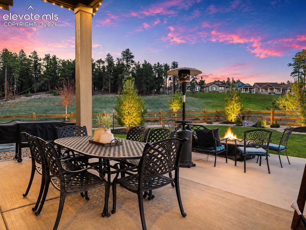 Image 6 of 50: A FRONT-ROW SEAT TO NATURE — Relax beneath the covered patio and enjoy the