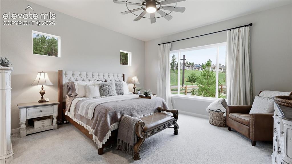 Image 7 of 50: A SERENE MAIN-LEVEL RETREAT — This spacious main-level retreat pairs specta