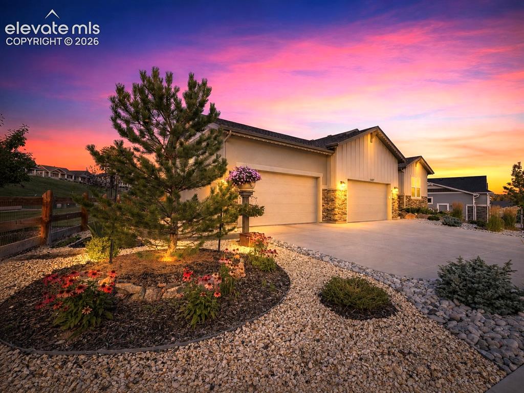 Image 9 of 50: A SETTING THAT IMPRESSES — Perfectly situated on a prominent corner lot, of