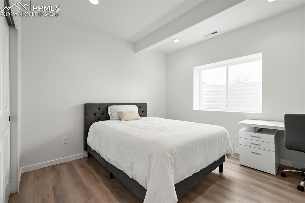 Image 28 of 38: Bedroom featuring recessed lighting, light wood-type flooring, and an offic