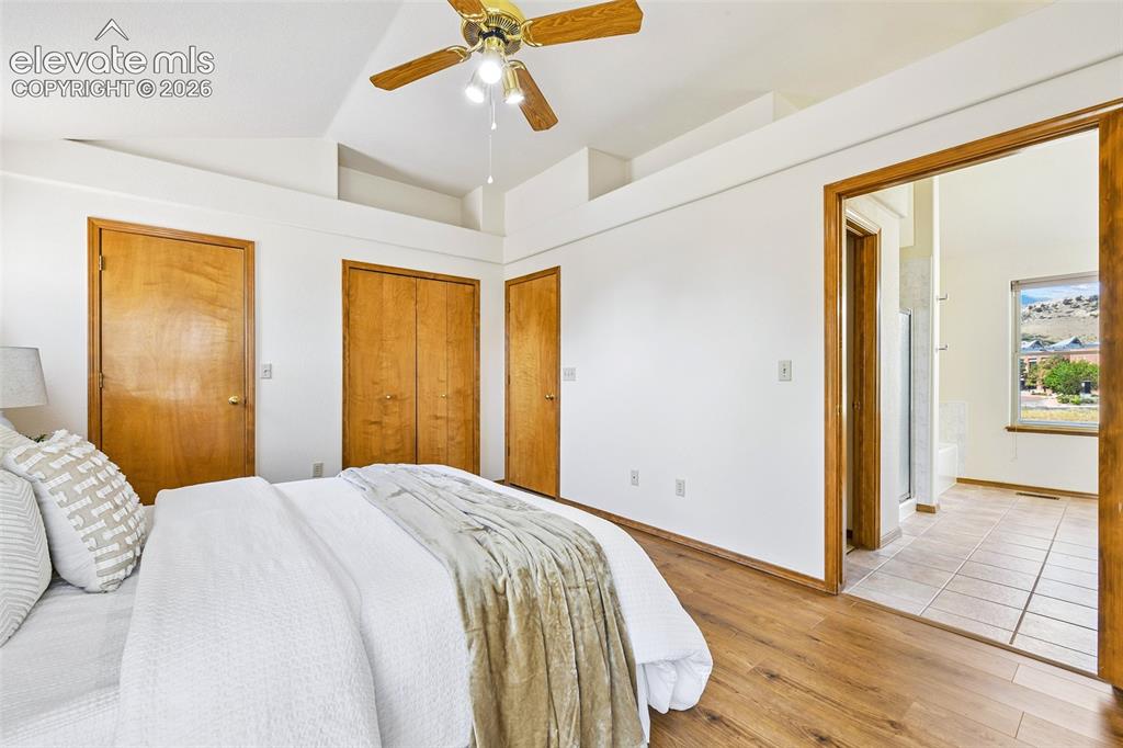 Image 18 of 42: Vaulted hardwood Primary with fresh paint