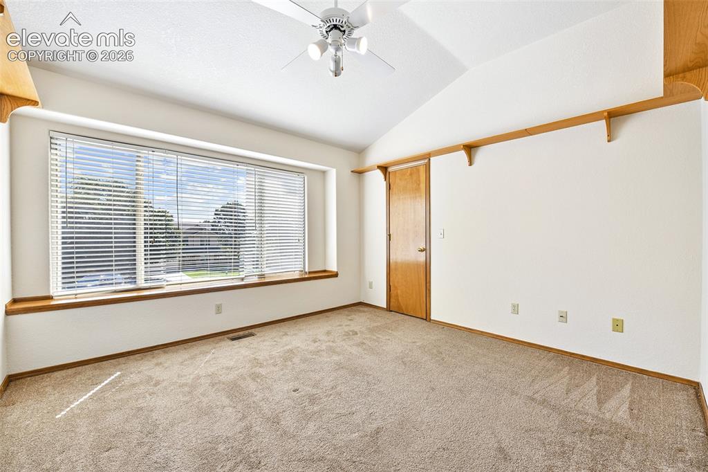 Image 23 of 42: Upper floor vaulted office/media room w/LVP flooring and…