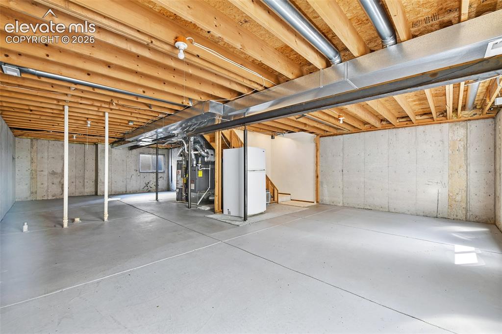 Image 28 of 42: 3rd vaulted upper bedroom.