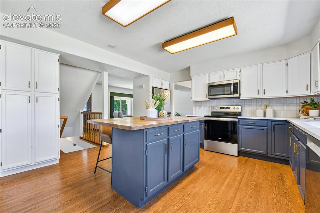 Image 8 of 42: Views and kitchen access from dining room