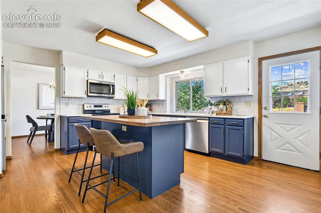 Image 9 of 42: VIEWS continue in walkout kitchen!