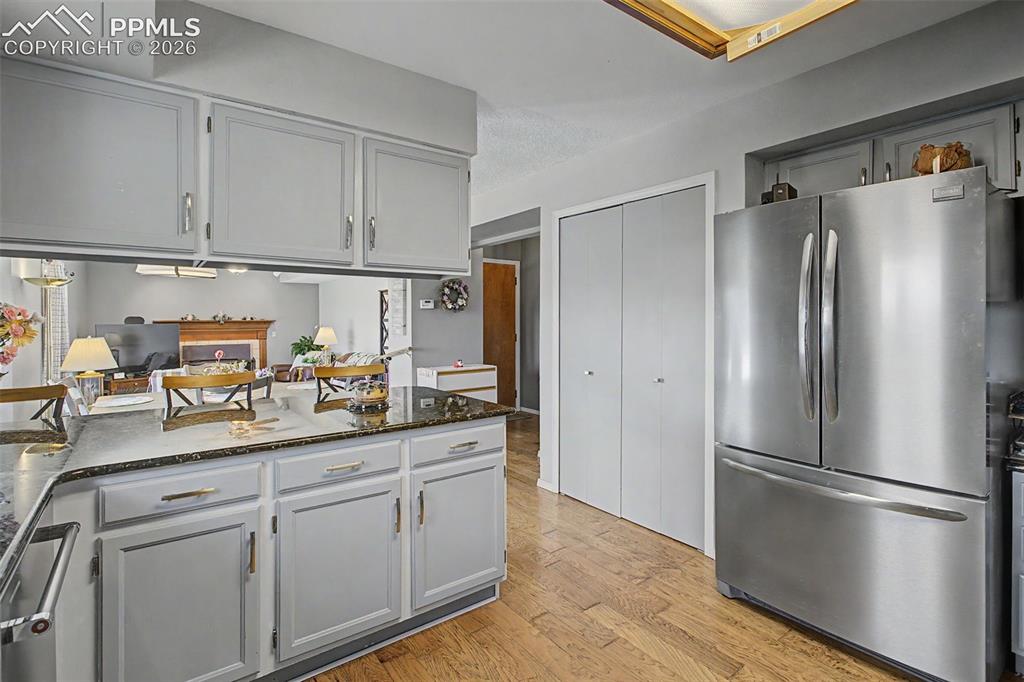 Image 14 of 46: Kitchen with stainless steel appliances and pantry.