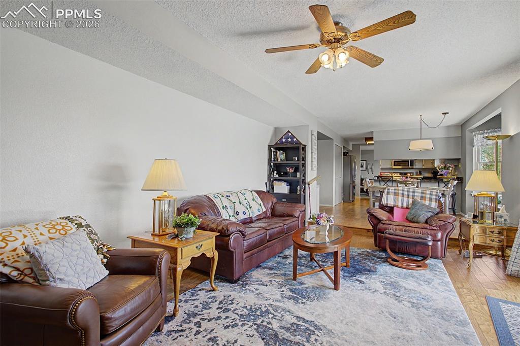 Image 19 of 46: Family room facing back to the breakfast area/kitchen.