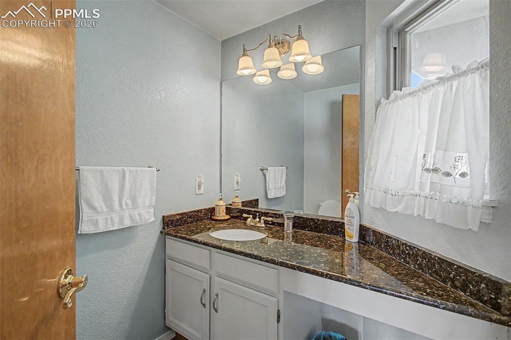 Image 20 of 46: Main level 1/2 bathroom.