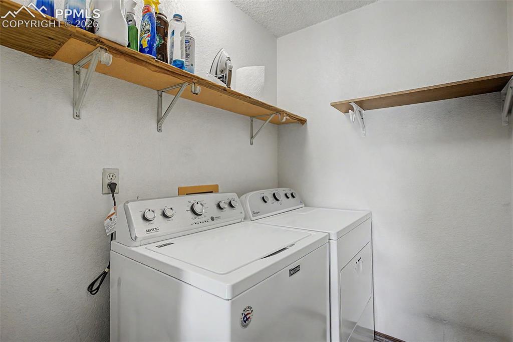 Image 31 of 46: Laundry room is on the upper level.