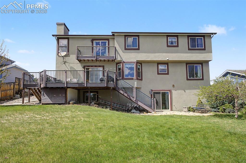 Image 4 of 46: Back of home- note the upper AND lower decks.