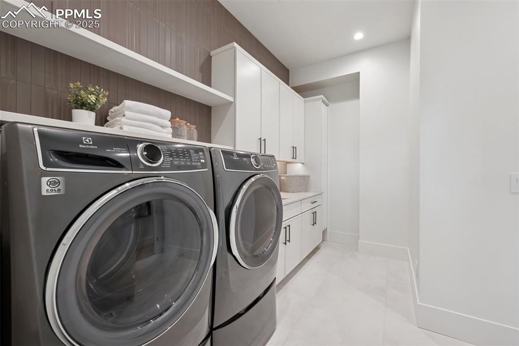 Image 22 of 50: Main Level Laundry off of Primary Closet