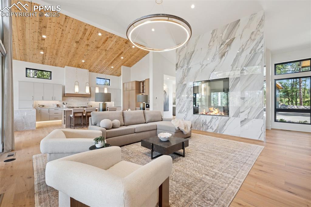 Image 27 of 50: Great Room with Marble surround 5x5 fireplace