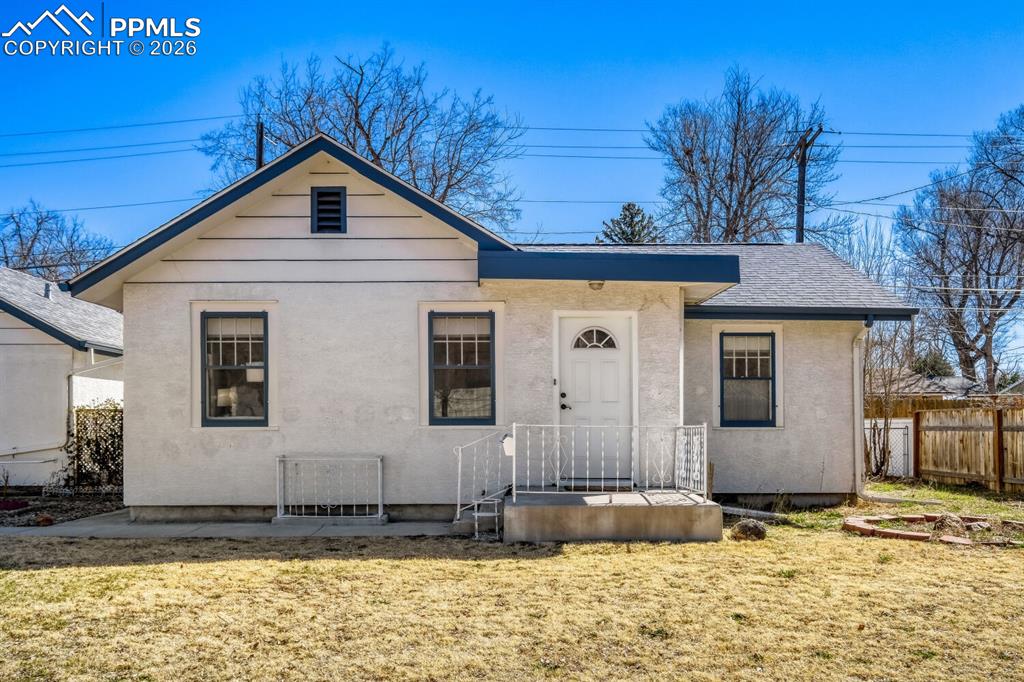 Caption: View of front of home with roof with shingles